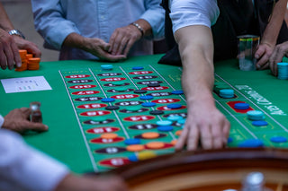 a group of people playing a game of crap at a casino