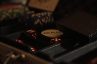 A black case holds red dice and a